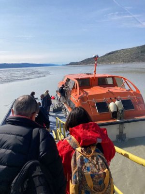 A tender transfers guests to the LAustral