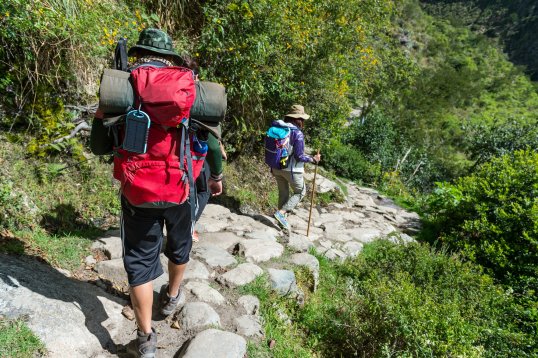 Hikers with back packs walking on the Inca Trail Hikers with back packs walking on the Inca Trail