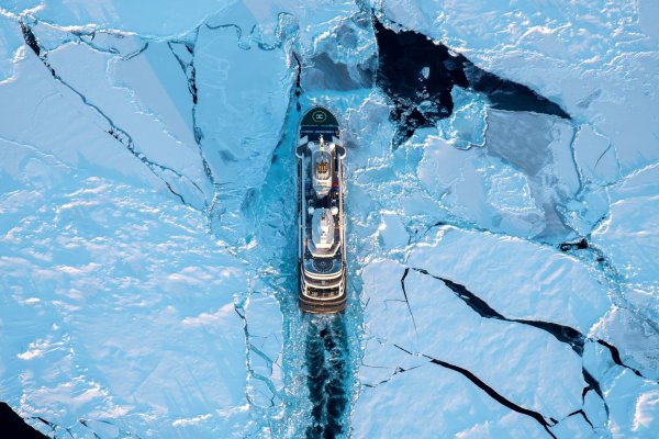 Le Commandant Charcot Aerial shot of cruise ship surrounded by ice