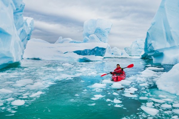 Kayaking between icebergs in Antarctica Kayaking between icebergs in Antarctica