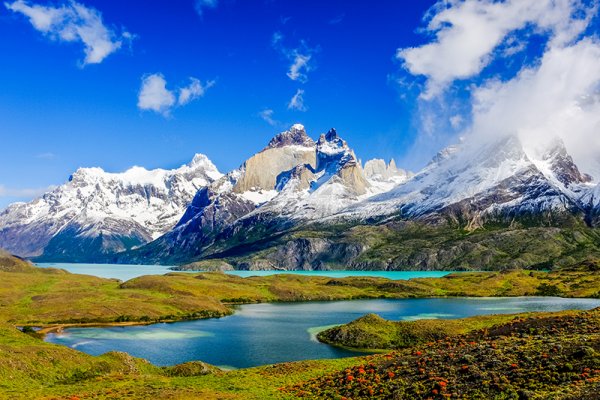 Beautiful Patagonia landscape of Andes mountain range, winding road and lake at Torres del Paine National Park, Chile. Beautiful Patagonia landscape of Andes mountain range, winding road and lake at