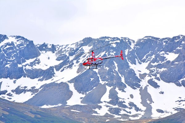 Tourist helicopter flying over the city of Ushuaia Tourist helicopter flying over the city of Ushuaia