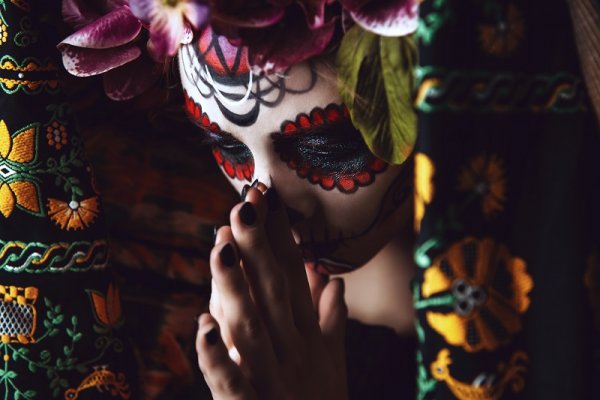 Girl with traditional sugar skull makeup Girl with traditional sugar skull makeup