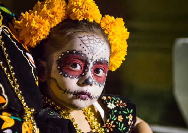 Little Calaca - Mexican girl in Day of the Dead makeup and costume Little Calaca - Mexican girl in Day of the Dead makeup and costume