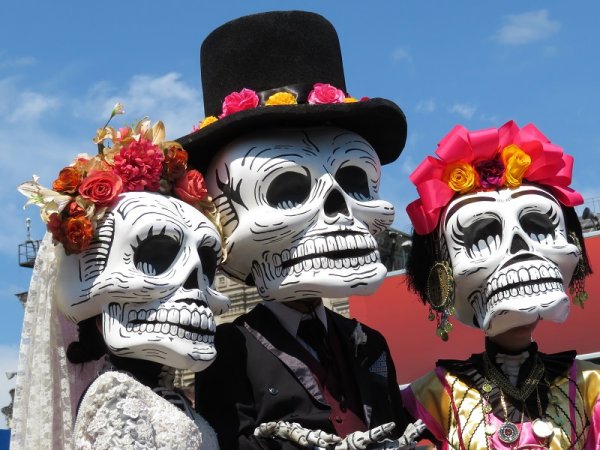 Day of the Dead participants with death masks Day of the Dead participants with death masks