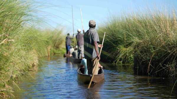 Chobe National Park Locals and tourist in wetlands of the Okavango Chobe National Park Locals and tourist in wetlands of the Okavango