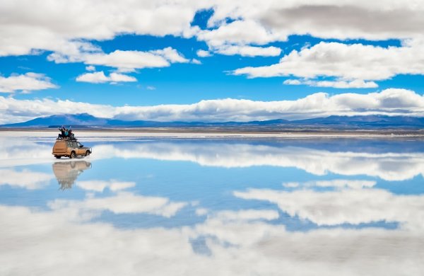 Driving across the Bolivian salt flats Driving across the Bolivian salt flats